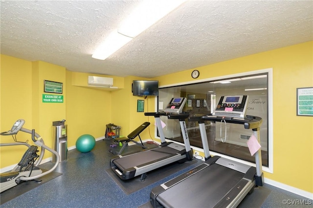 2956 Hathaway Rd Unit U606, Richmond, VA 23225 - exercise room featuring a wall mounted AC and a textured ceiling