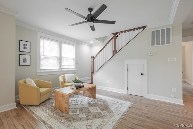 4806 Cutshaw Ave, Richmond, VA 23230 - living room featuring crown molding, stairway, light wood finished floors, and a ceiling fan