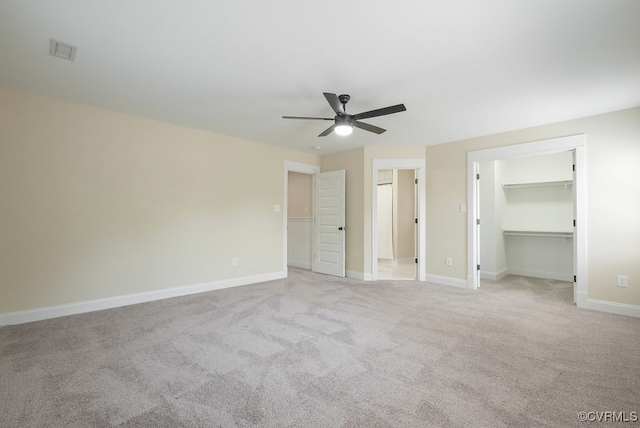 4806 Cutshaw Ave, Richmond, VA 23230 - unfurnished bedroom with light colored carpet, a spacious closet, a ceiling fan, and a closet