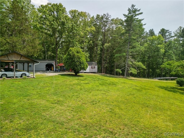 967 Ampthill Rd, Cartersville, VA 23027 - view of grassy yard featuring a detached carport, a storage shed, and driveway