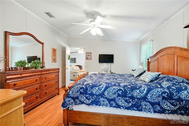 967 Ampthill Rd, Cartersville, VA 23027 - bedroom with ornamental molding, light wood-style floors, a textured ceiling, and ceiling fan