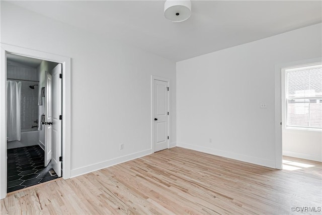 1210 N 36th St, Richmond, VA 23223 - empty room with light wood-style floors and baseboards