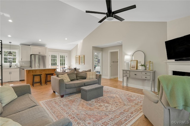 1380 Locust Hill Rd, Aylett, VA 23009 - living area with a ceiling fan, light wood finished floors, a fireplace, recessed lighting, and high vaulted ceiling