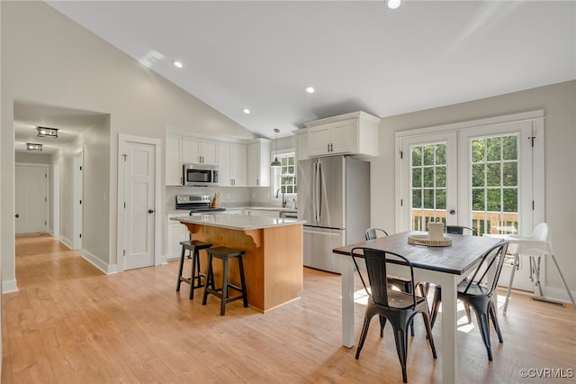 1380 Locust Hill Rd, Aylett, VA 23009 - kitchen featuring appliances with stainless steel finishes, a center island, light countertops, white cabinetry, and recessed lighting