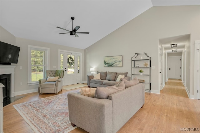 1380 Locust Hill Rd, Aylett, VA 23009 - living room with ceiling fan, high vaulted ceiling, light wood finished floors, and a fireplace with flush hearth