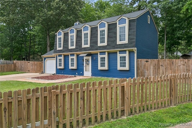 5 Hadley Pl, Newport News, VA 23608 - view of front of home with a gambrel roof, concrete driveway, an attached garage, a shingled roof, and view of scattered trees
