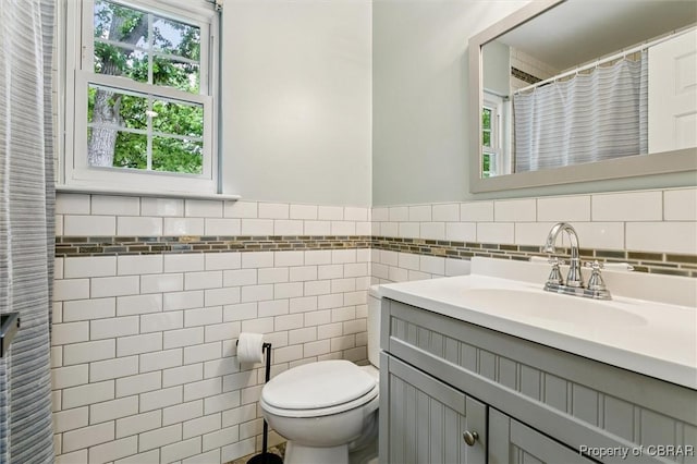 5 Hadley Pl, Newport News, VA 23608 - bathroom featuring tile walls, vanity, and wainscoting