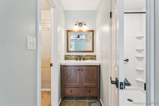 5 Hadley Pl, Newport News, VA 23608 - bathroom with vanity, a shower, a spacious closet, backsplash, and ceiling fan