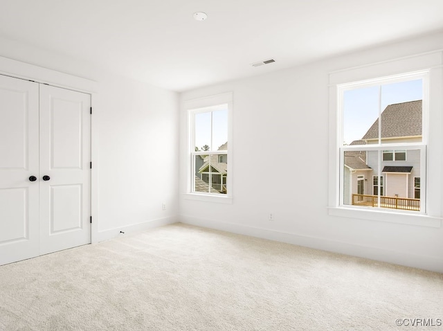 13513 Pinstone Ct, Midlothian, VA 23112 - unfurnished bedroom featuring multiple windows, carpet, and a closet