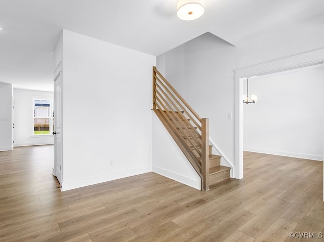 13513 Pinstone Ct, Midlothian, VA 23112 - staircase featuring wood finished floors and a chandelier