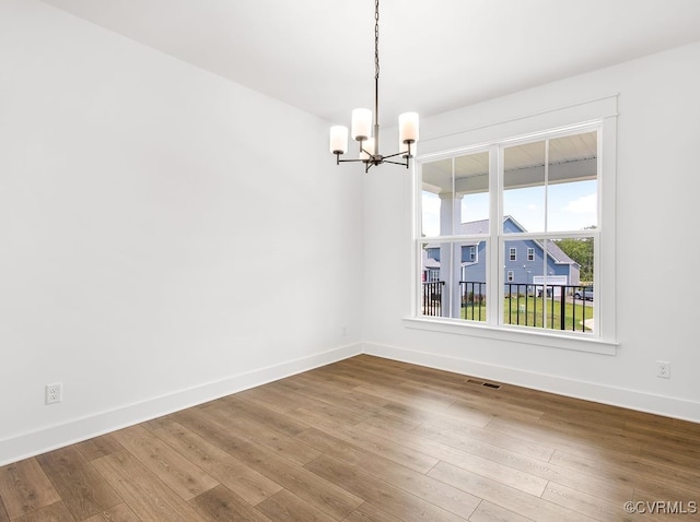 13513 Pinstone Ct, Midlothian, VA 23112 - empty room with a chandelier and wood finished floors
