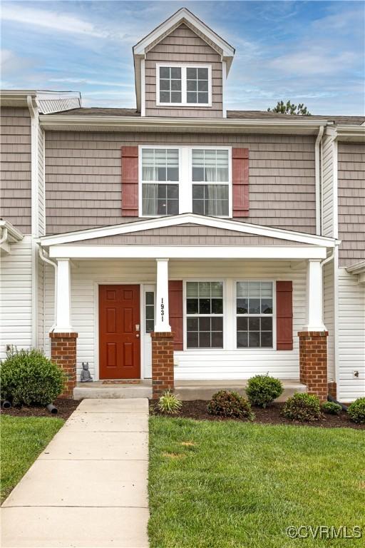 1931 Kennington Park Rd, King William, VA 23009 - view of front facade with a porch and a front lawn
