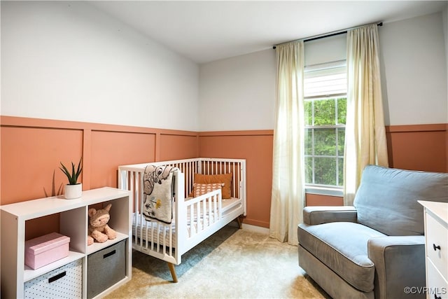 1931 Kennington Park Rd, King William, VA 23009 - bedroom with a decorative wall, light carpet, wainscoting, and a crib