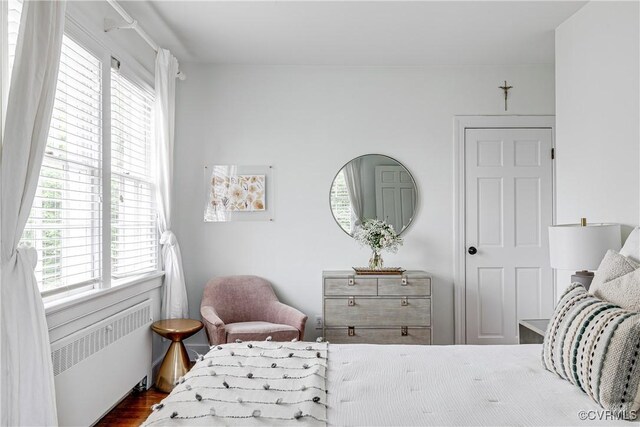 4508 Augusta Ave, Richmond, VA 23230 - bedroom with radiator heating unit, multiple windows, and dark wood-type flooring