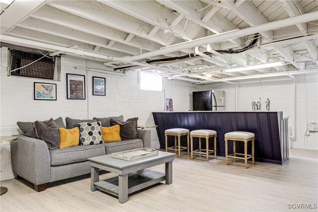 4508 Augusta Ave, Richmond, VA 23230 - living area featuring light wood finished floors and concrete block wall