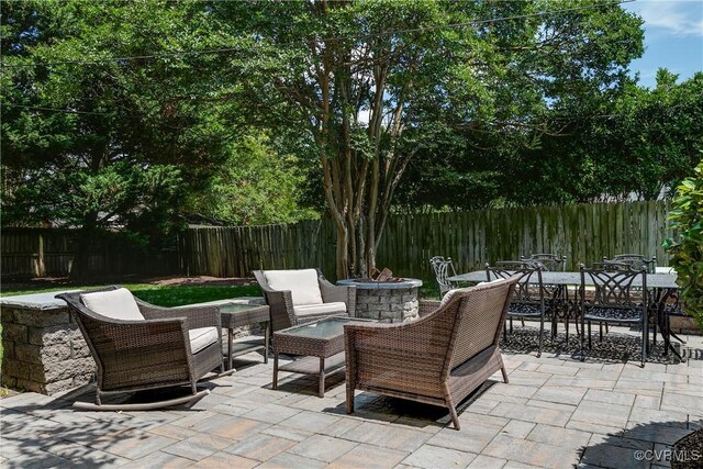 4508 Augusta Ave, Richmond, VA 23230 - fenced backyard featuring a patio and outdoor dining area