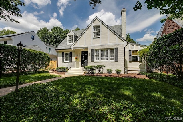 4508 Augusta Ave, Richmond, VA 23230 - tudor house featuring brick siding and a chimney