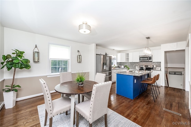 8411 Freestone Ave, Henrico, VA 23229 - dining room with dark wood finished floors and baseboards