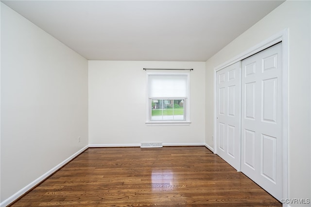 8411 Freestone Ave, Henrico, VA 23229 - unfurnished bedroom with wood finished floors and a closet