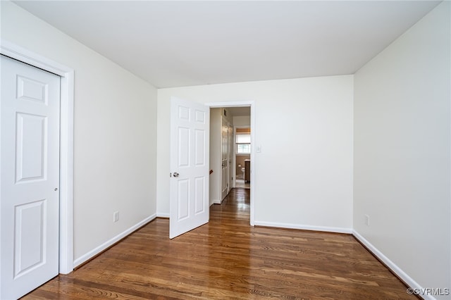 8411 Freestone Ave, Henrico, VA 23229 - unfurnished bedroom featuring wood finished floors and baseboards