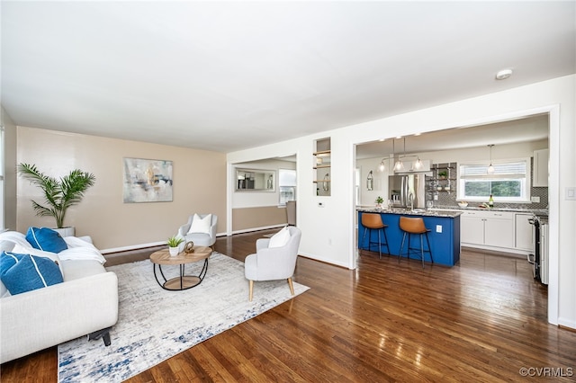 8411 Freestone Ave, Henrico, VA 23229 - living area with dark wood-style floors and baseboards