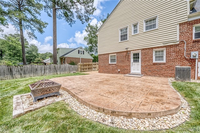 8411 Freestone Ave, Henrico, VA 23229 - back of property with a fire pit, brick siding, a patio, and a fenced backyard