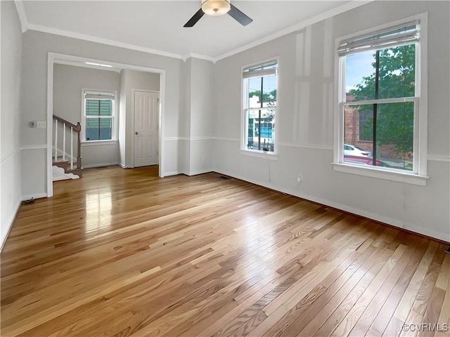 918 N 26th St, Richmond, VA 23223 - empty room featuring light wood finished floors, ornamental molding, stairway, and a ceiling fan