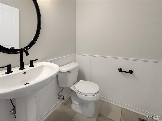918 N 26th St, Richmond, VA 23223 - bathroom featuring toilet and baseboards