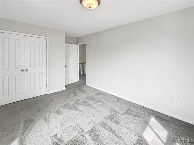 918 N 26th St, Richmond, VA 23223 - unfurnished bedroom featuring carpet flooring and a closet