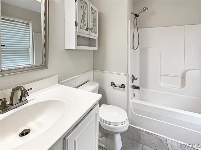 918 N 26th St, Richmond, VA 23223 - bathroom featuring vanity, shower / tub combination, and wainscoting