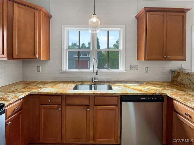 918 N 26th St, Richmond, VA 23223 - kitchen with stainless steel dishwasher, decorative backsplash, brown cabinetry, and light stone countertops