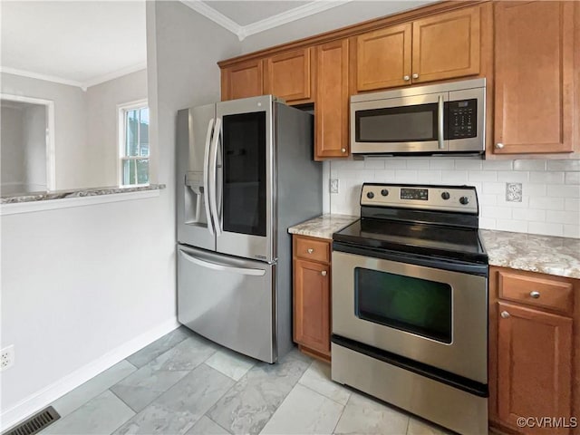 918 N 26th St, Richmond, VA 23223 - kitchen featuring stainless steel appliances, brown cabinets, crown molding, decorative backsplash, and light stone counters