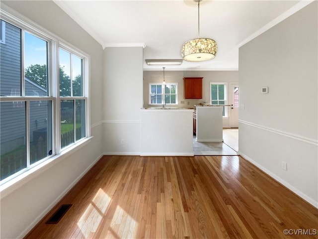 918 N 26th St, Richmond, VA 23223 - empty room featuring crown molding and light wood-type flooring