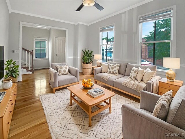 918 N 26th St, Richmond, VA 23223 - living area featuring crown molding, stairway, light wood-style floors, and ceiling fan