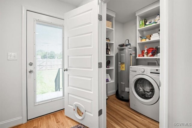 1508 N 29th St, Richmond, VA 23223 - laundry room featuring washer / dryer, electric water heater, and wood finished floors