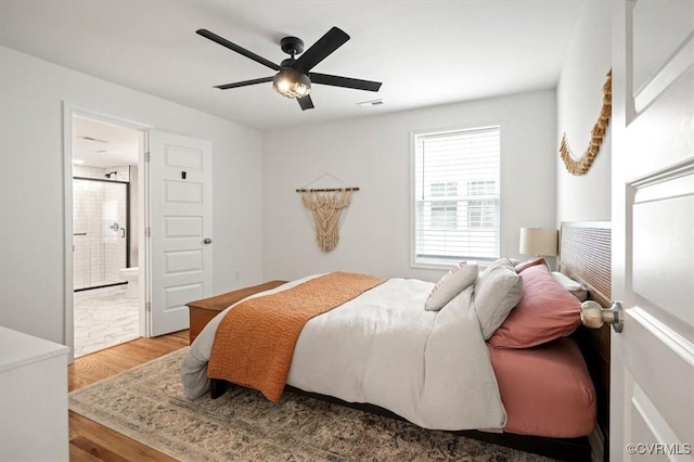 1508 N 29th St, Richmond, VA 23223 - bedroom with wood finished floors, connected bathroom, and ceiling fan