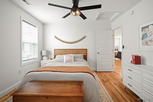 1508 N 29th St, Richmond, VA 23223 - bedroom featuring light wood-type flooring, attic access, multiple windows, and ceiling fan
