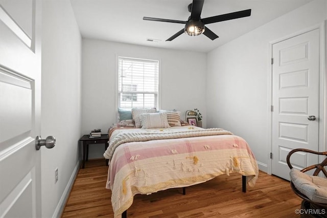 1508 N 29th St, Richmond, VA 23223 - bedroom with wood finished floors and a ceiling fan