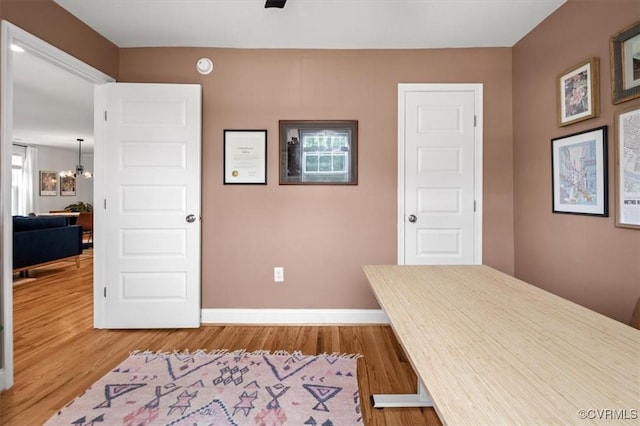 1508 N 29th St, Richmond, VA 23223 - unfurnished office with wood finished floors and a chandelier