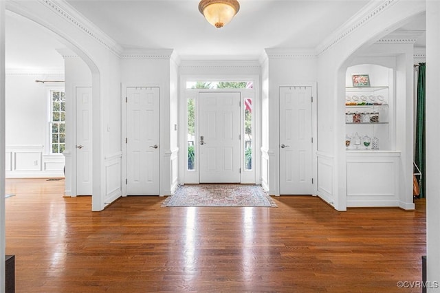 12829 Huntmaster Ln, Henrico, VA 23233 - foyer entrance with ornamental molding, wood finished floors, healthy amount of natural light, a decorative wall, and arched walkways
