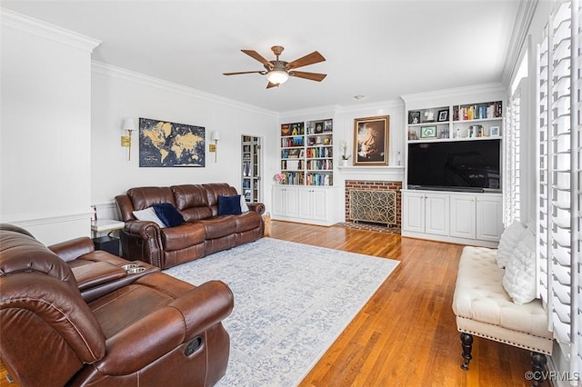 12829 Huntmaster Ln, Henrico, VA 23233 - living area with a ceiling fan, light wood-style flooring, crown molding, and built in shelves