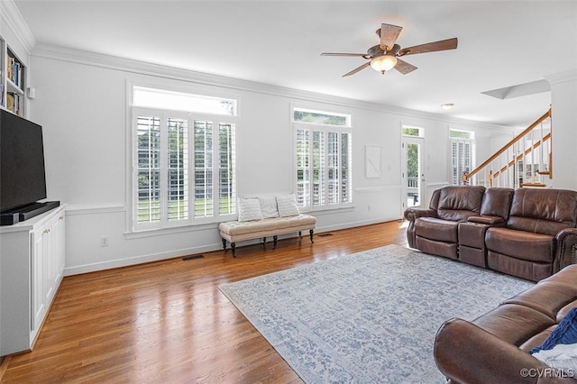 12829 Huntmaster Ln, Henrico, VA 23233 - living room with ornamental molding, plenty of natural light, stairs, a ceiling fan, and wood finished floors
