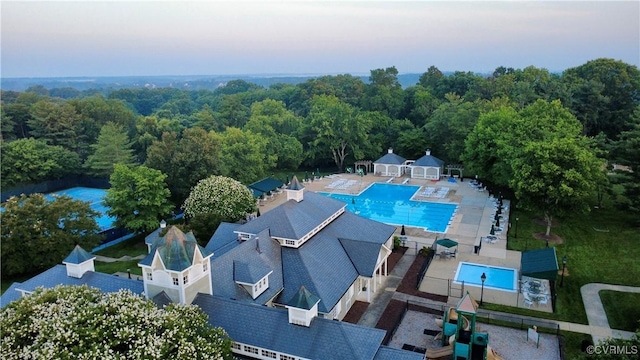 12829 Huntmaster Ln, Henrico, VA 23233 - drone / aerial view of a pool and a heavily wooded area