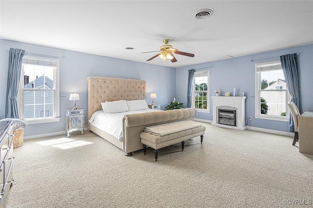 12829 Huntmaster Ln, Henrico, VA 23233 - carpeted bedroom with ceiling fan and a glass covered fireplace