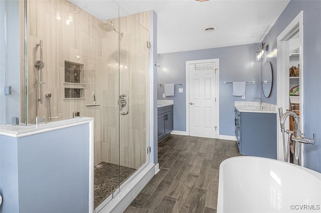 12829 Huntmaster Ln, Henrico, VA 23233 - full bath with a shower stall, vanity, wood finished floors, and a freestanding bath
