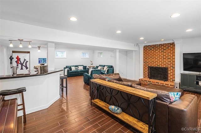 12829 Huntmaster Ln, Henrico, VA 23233 - living area with dark wood-style floors, recessed lighting, and a brick fireplace