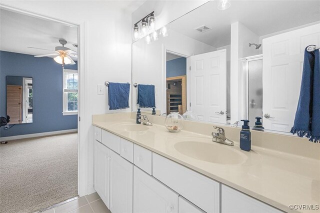 12829 Huntmaster Ln, Henrico, VA 23233 - bathroom featuring double vanity, ceiling fan, a shower with shower door, and tile patterned floors