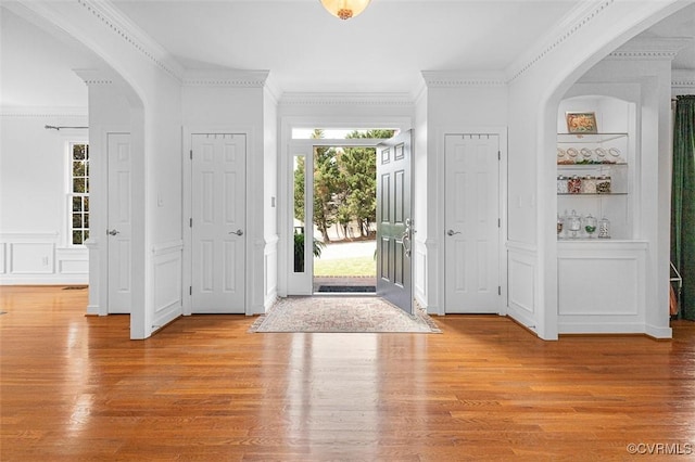 12829 Huntmaster Ln, Henrico, VA 23233 - entrance foyer featuring a decorative wall, light wood finished floors, crown molding, and wainscoting