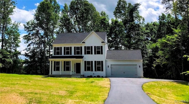 4801 Partlow Rd, Spotsylvania, VA 22534 - colonial home with asphalt driveway, a garage, a front yard, and roof with shingles