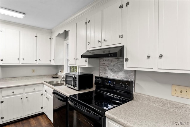 3401 Quail Hill Dr, Chesterfield, VA 23112 - kitchen with under cabinet range hood, black appliances, light countertops, white cabinets, and ornamental molding